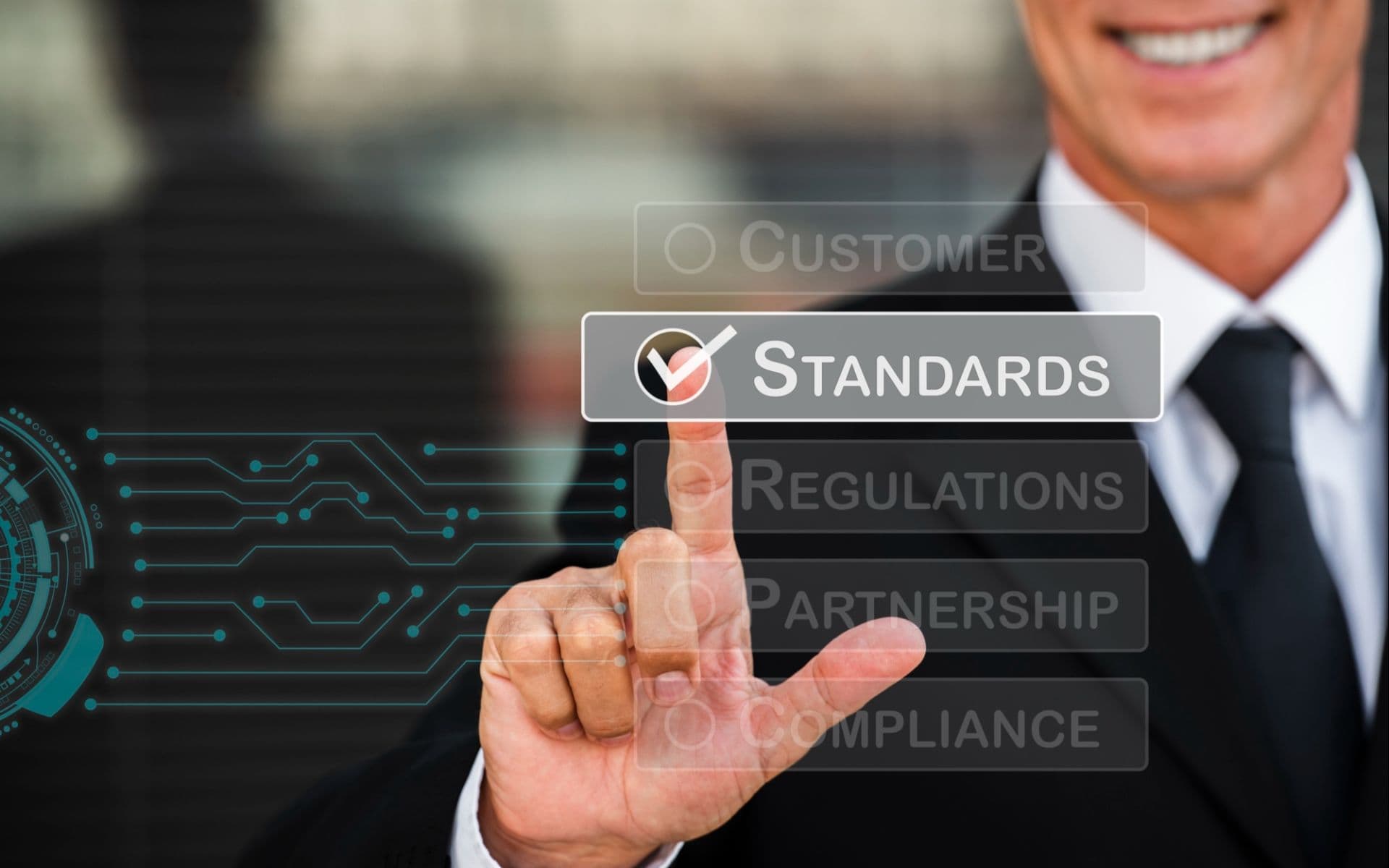 Business professional selecting standards on a digital interface to represent ISO 9001 quality management